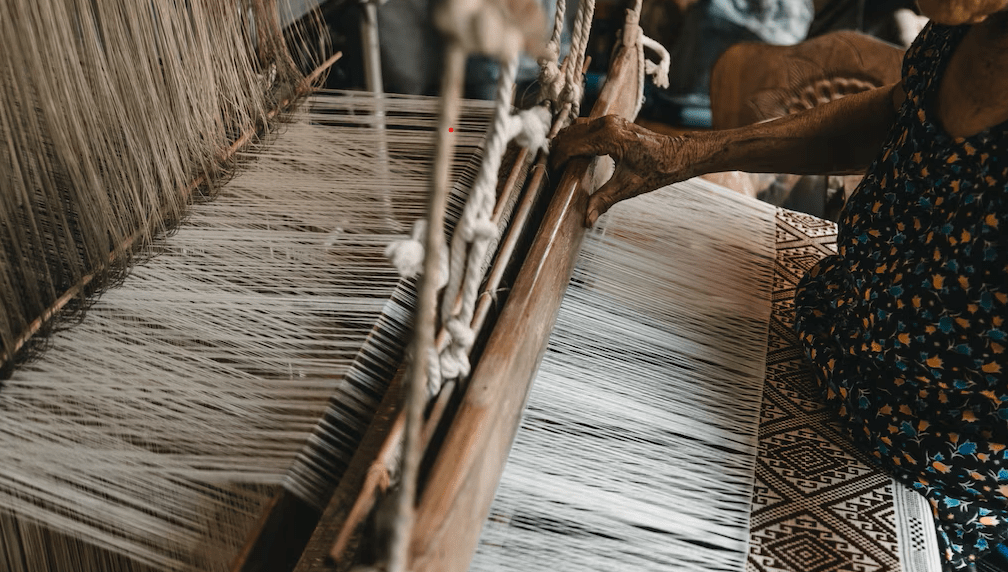 tradition to modern old women using a handloom