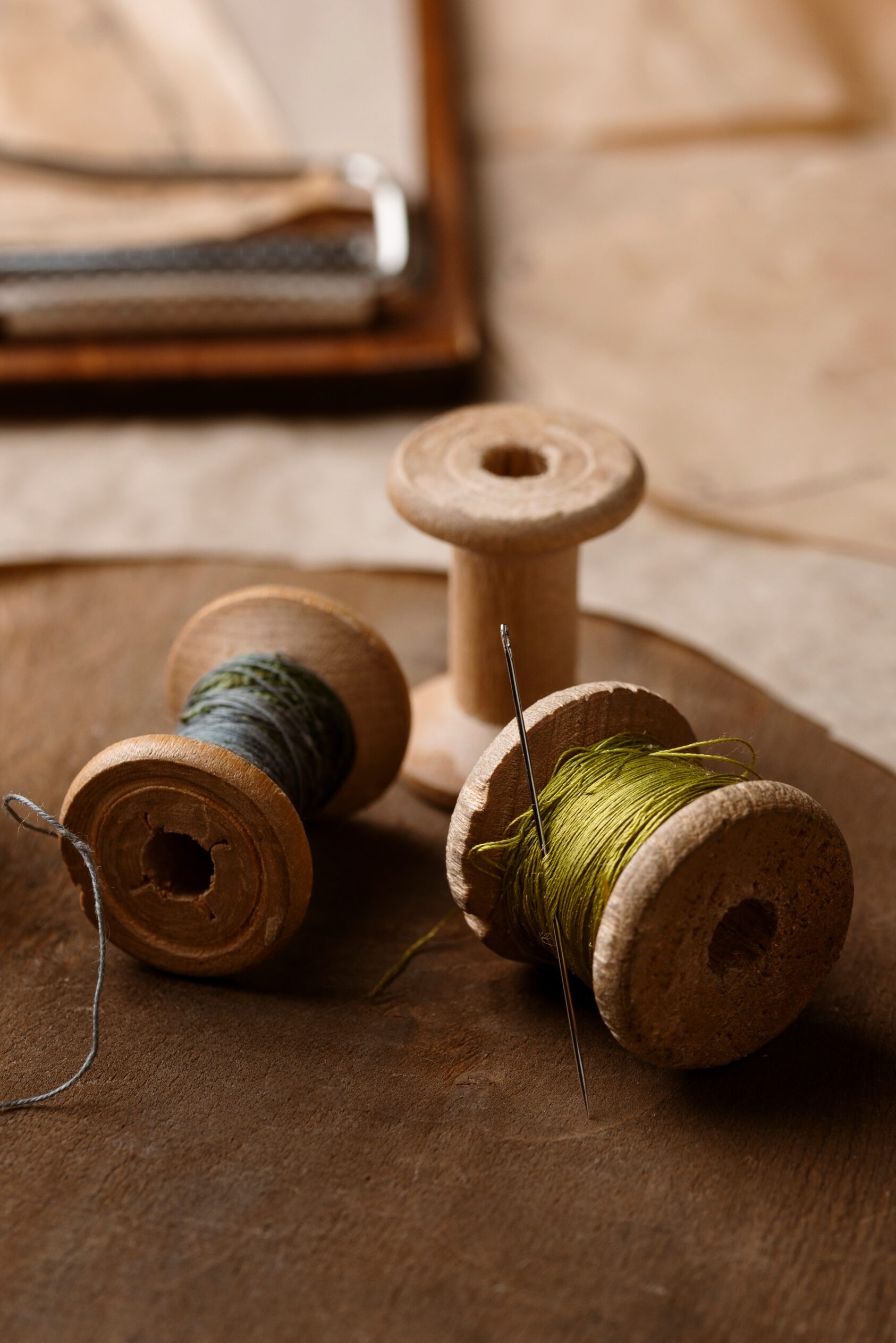 tradition to modern green and blue color thread rolls with a needle